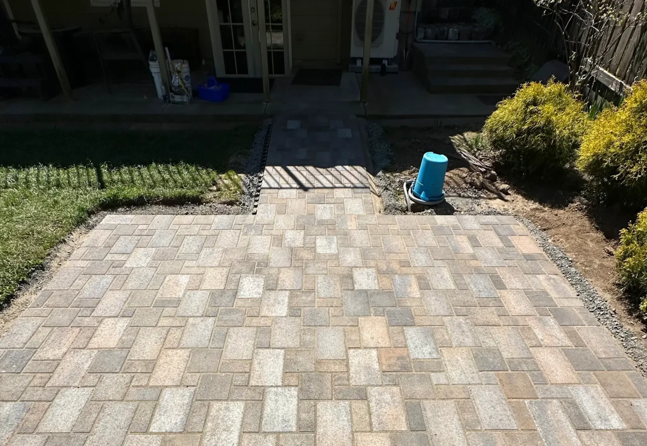 Professional paver patio and walkway installation for a residential backyard
